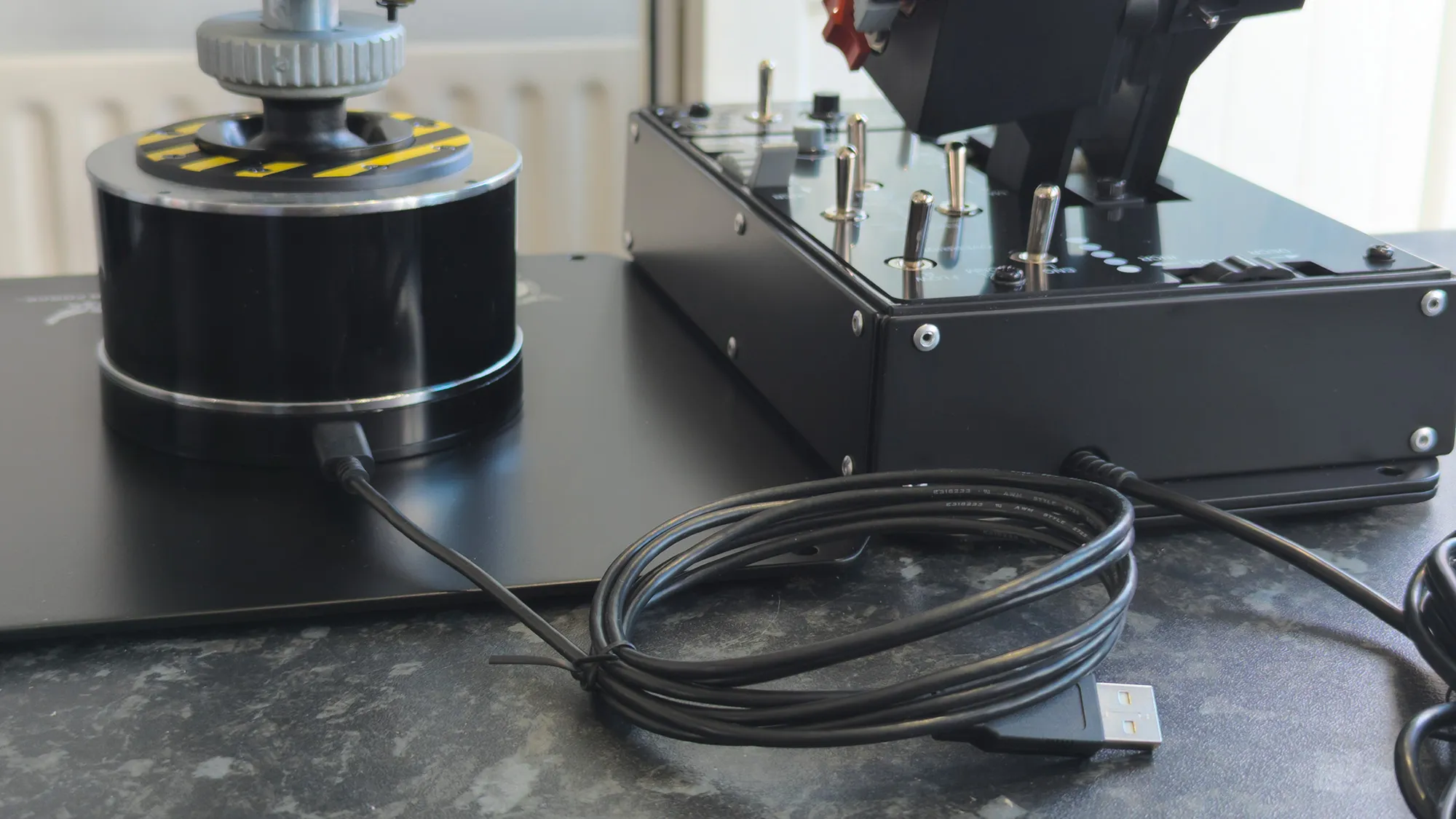 Thrustmaster HOTAS WARTHOG MK II rear side with USB-C to USB-A cables from the throttle base and flight stick