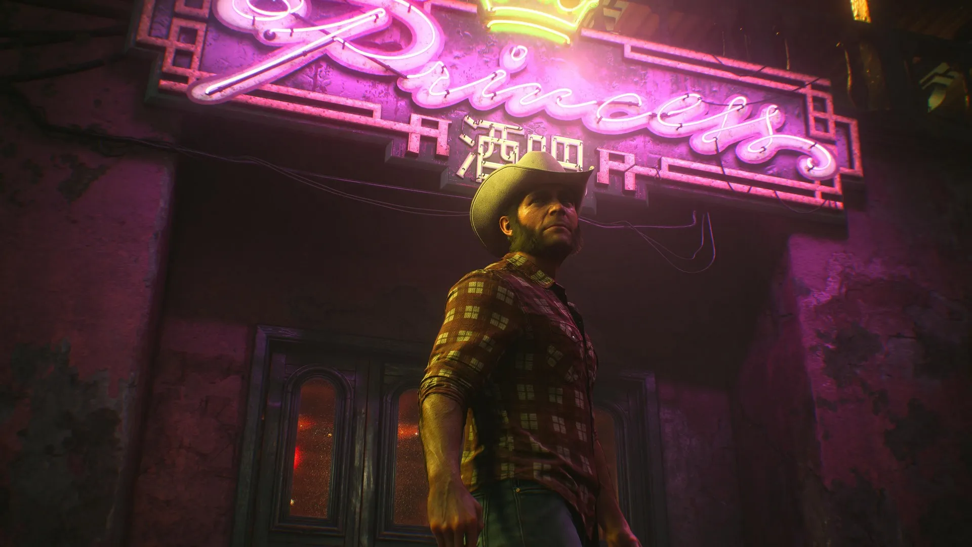 Logan looks out across Madripoor in casualwear in Marvel's Wolverine, illuminated by the pink neon of Princess Bar