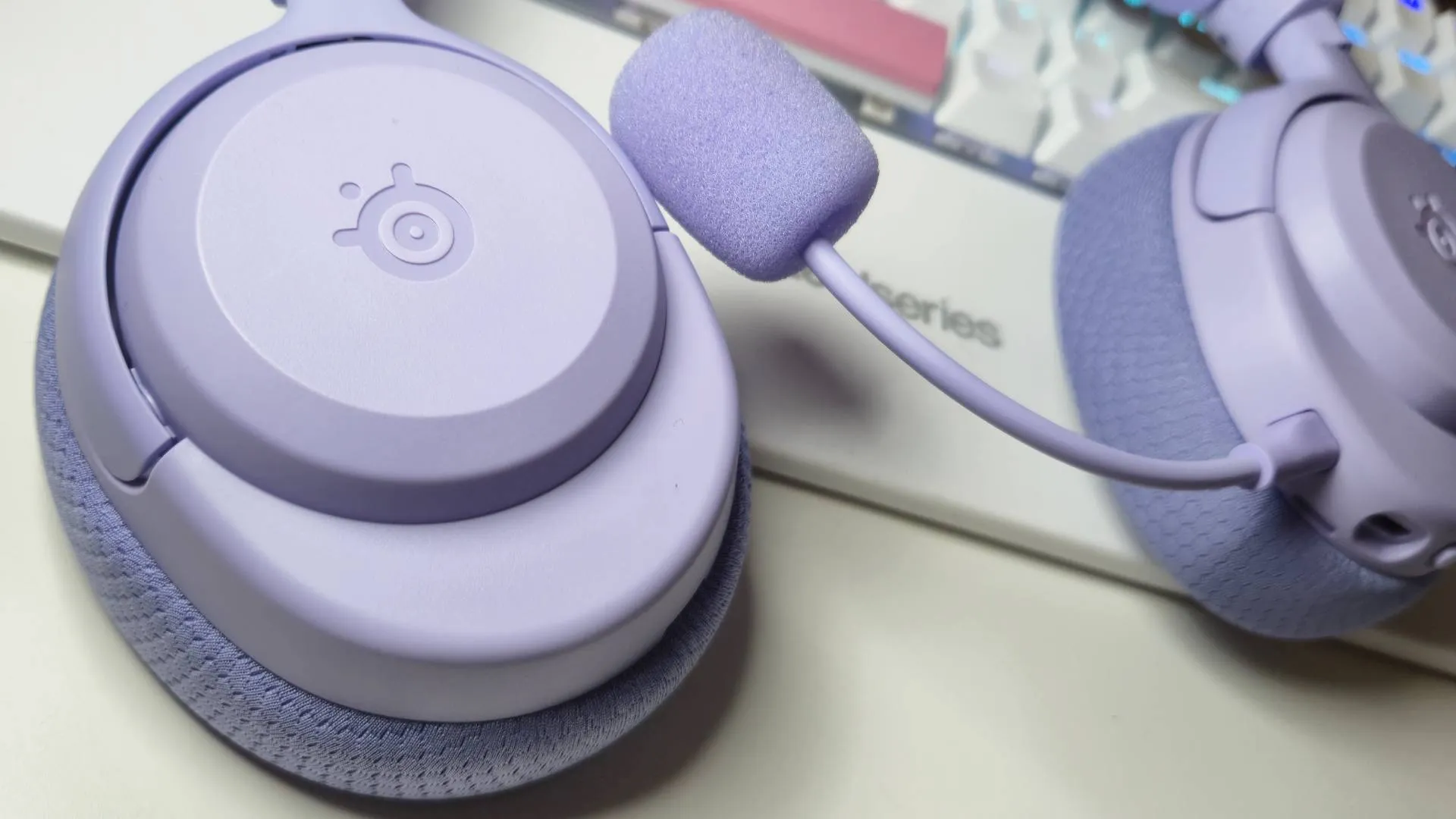 Close up on left cup of lilac SteelSeries Arctis Nova 3 gaming headset