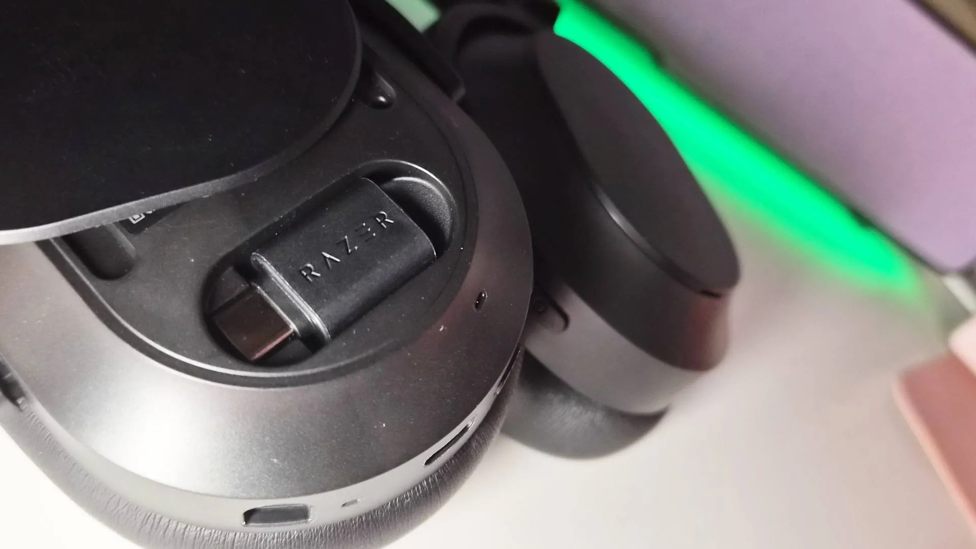 Photo of the Razer Barracuda V2 Pro headset sitting on a white desk.