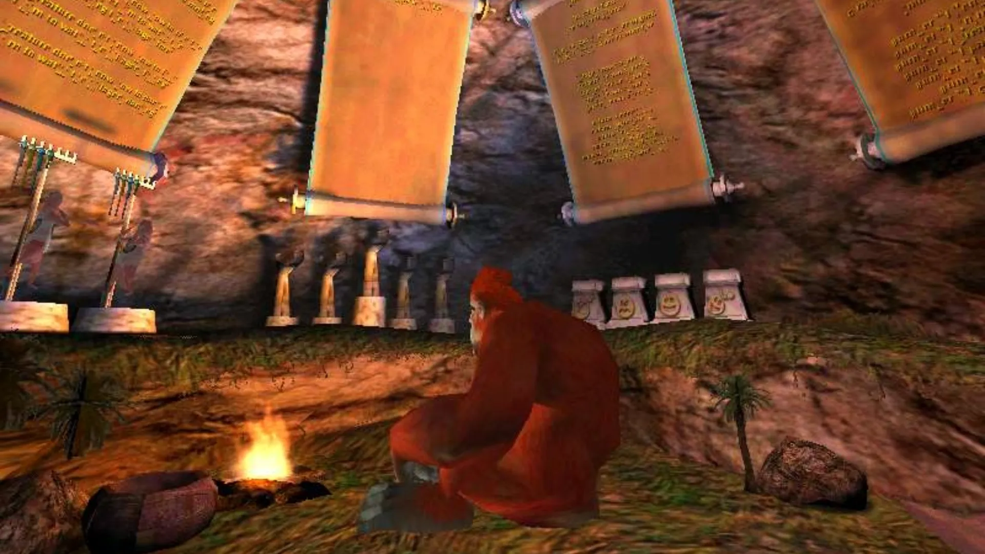 An orangutan sitting on the ground staring at a fire in Black &amp;amp; White