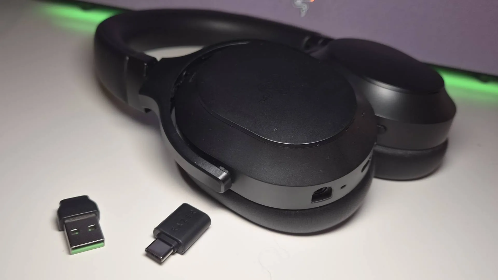 Photo of the Razer Barracuda V2 Pro headset sitting on a white desk.