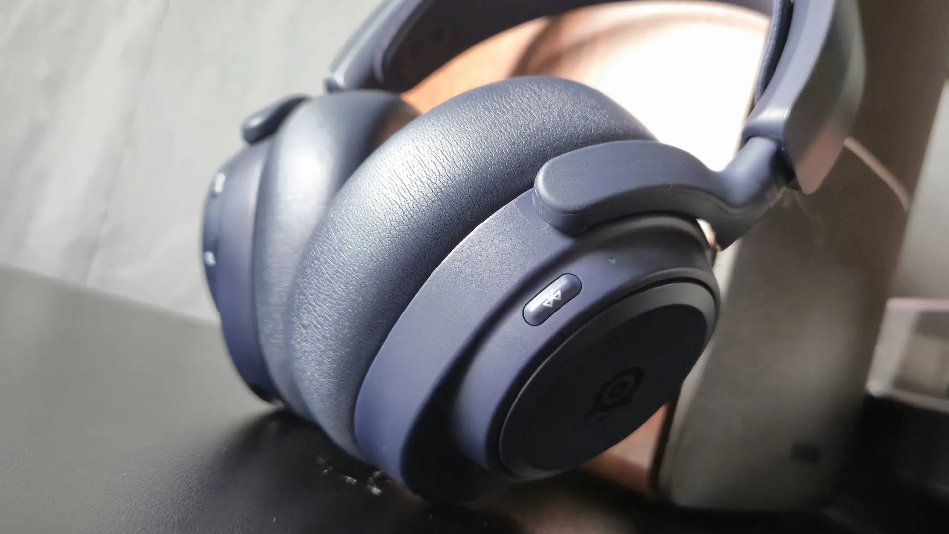 Close up of the earcups of the SteelSeries Arctis Nova Pro Omni headset.